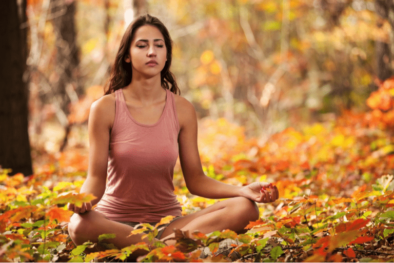 woman doing yoga, autumn leaves, fitness in the fall